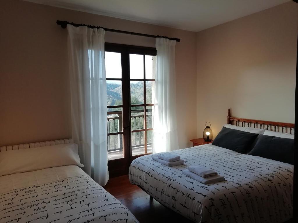 Postel nebo postele na pokoji v ubytování La Casa de les Oques