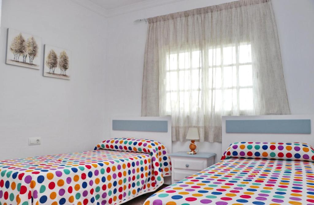 Postel nebo postele na pokoji v ubytování Apartamento Violeta