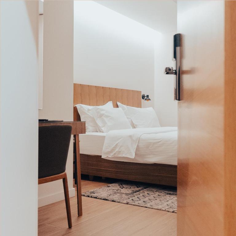 Postel nebo postele na pokoji v ubytování Hotel Theatro- City Center