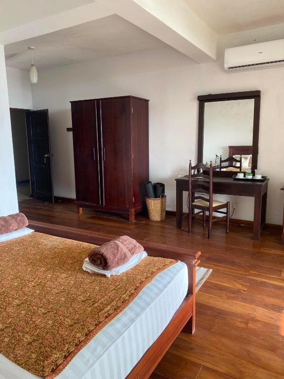 Postel nebo postele na pokoji v ubytování Spice of Ceylon