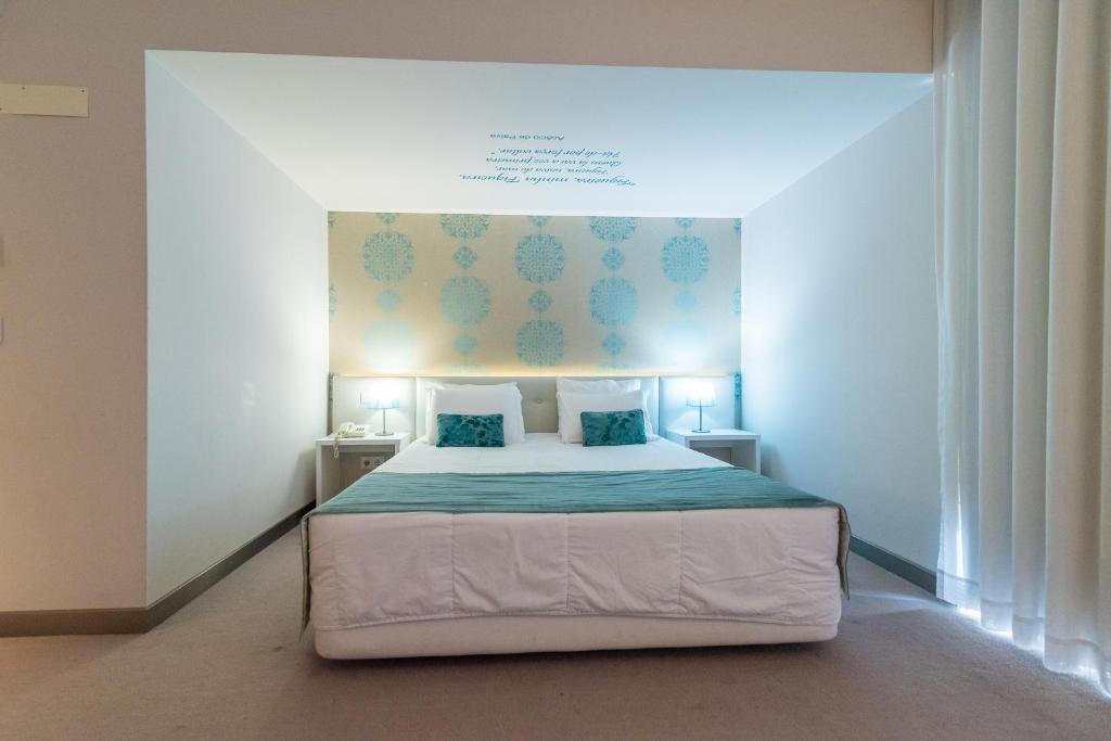 Postel nebo postele na pokoji v ubytování Costa de Prata Hotel
