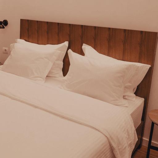 Postel nebo postele na pokoji v ubytování Hotel Theatro- City Center