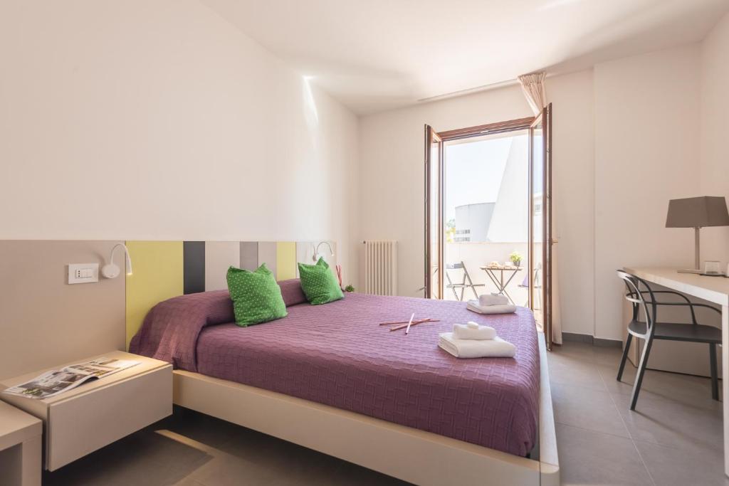 Łóżko lub łóżka w pokoju w obiekcie Casole Living B&B