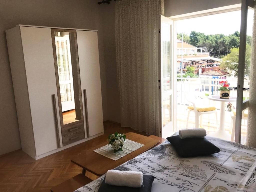 Кровать или кровати в номере Apartment & Rooms Riva