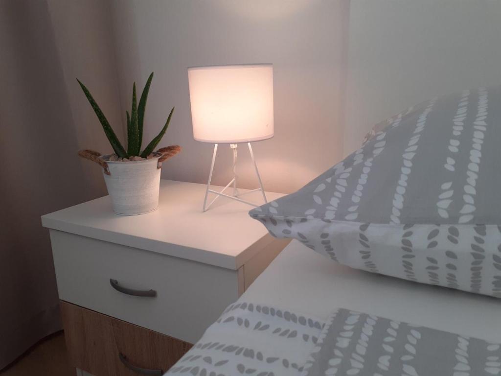 Кровать или кровати в номере Apartment & Rooms Riva