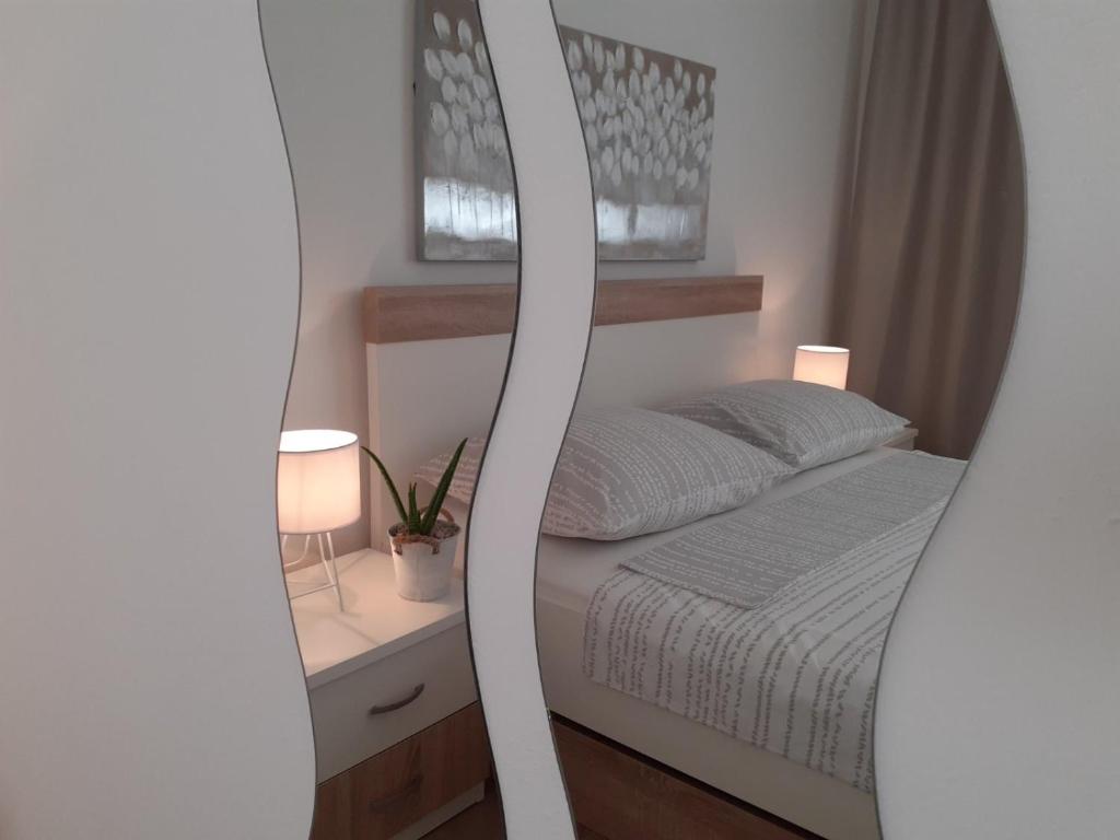 Кровать или кровати в номере Apartment & Rooms Riva