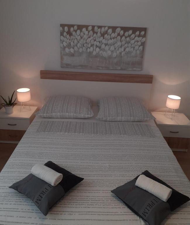 Кровать или кровати в номере Apartment & Rooms Riva