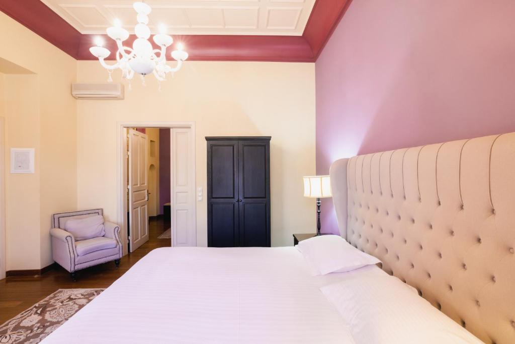 Postel nebo postele na pokoji v ubytování Kastello Hotel