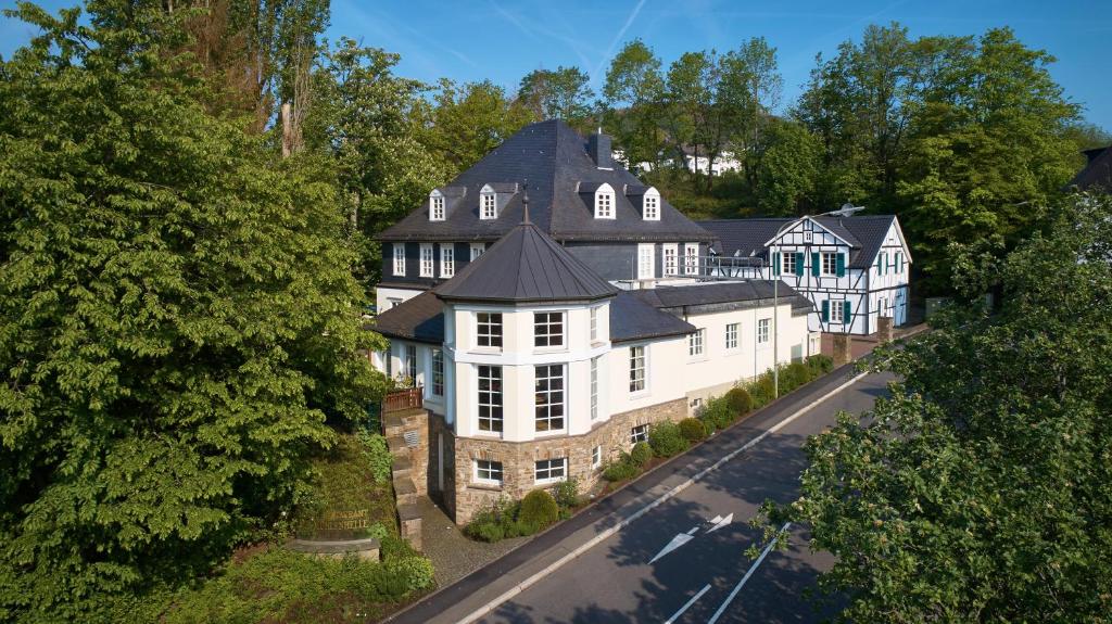 an aerial view of a large white house at Mühlenhelle in Gummersbach