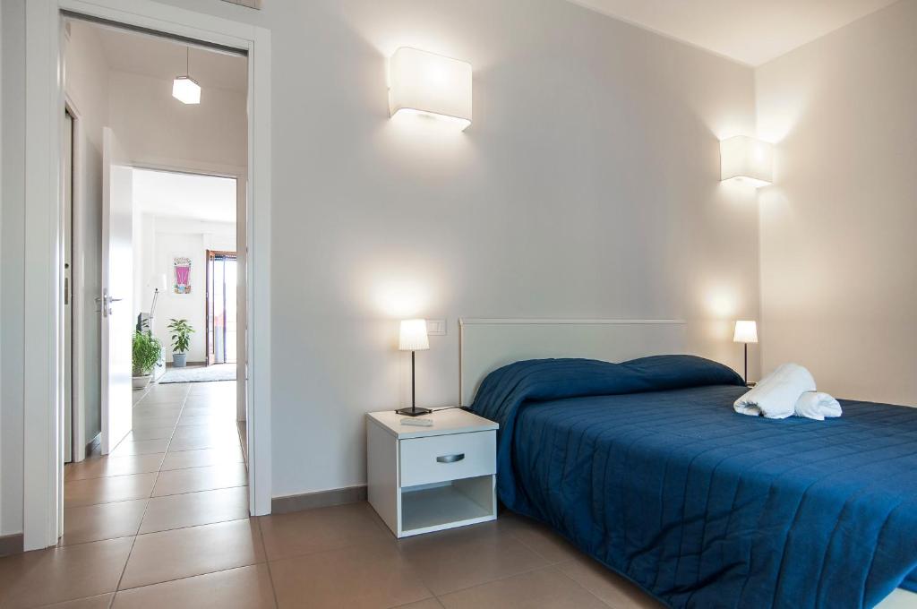 A bed or beds in a room at La Terrazza su Fondi