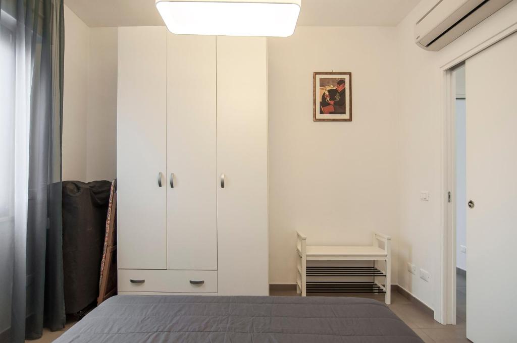A bed or beds in a room at La Terrazza su Fondi