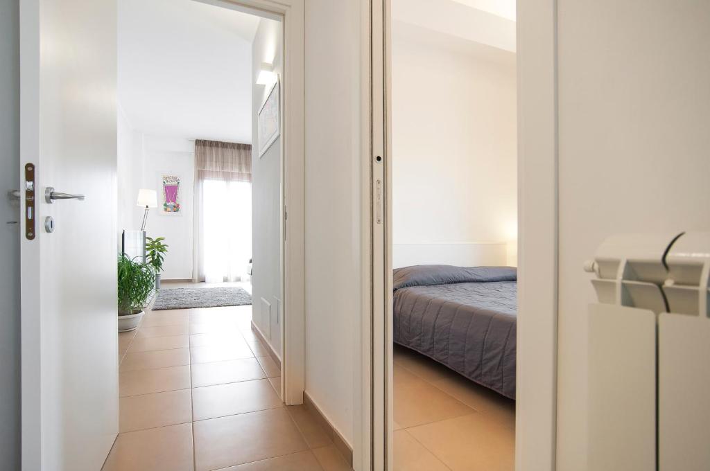 A bed or beds in a room at La Terrazza su Fondi