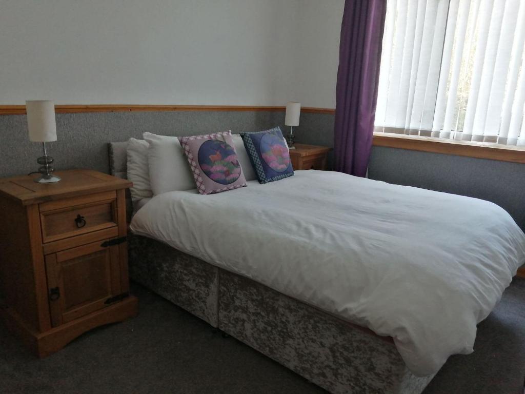 Postel nebo postele na pokoji v ubytování Don Muir Guesthouse