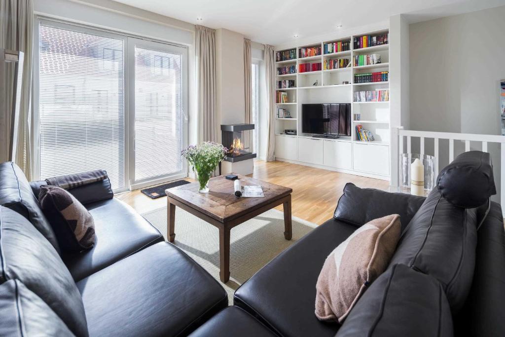 a living room with a couch and a coffee table at Robbenloft in Norderney