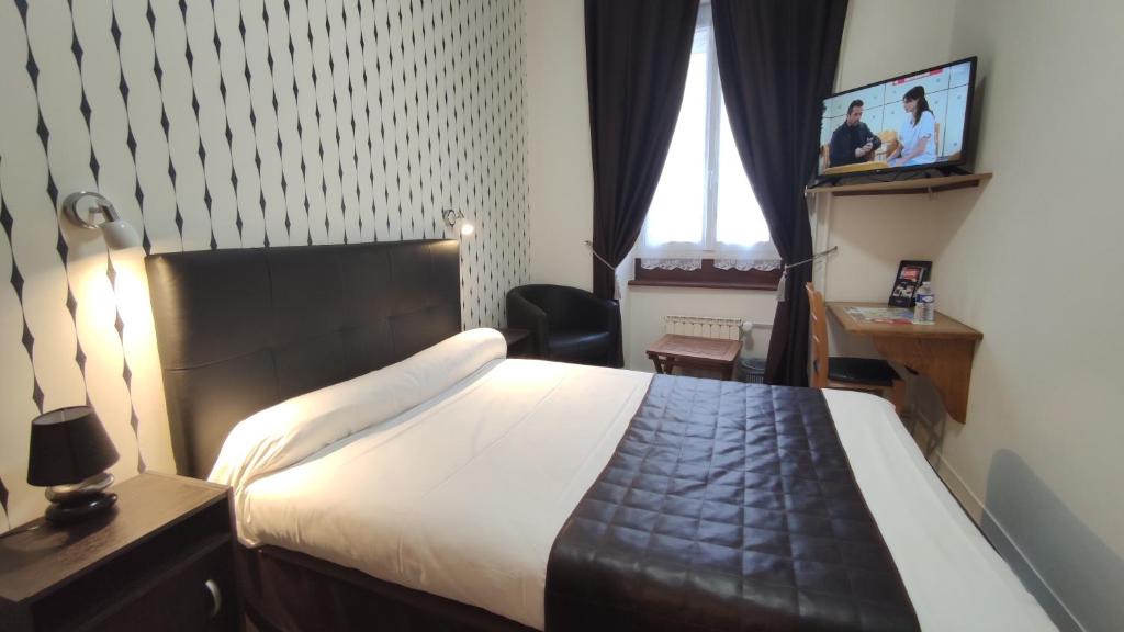 Postel nebo postele na pokoji v ubytování Hotel Angleterre