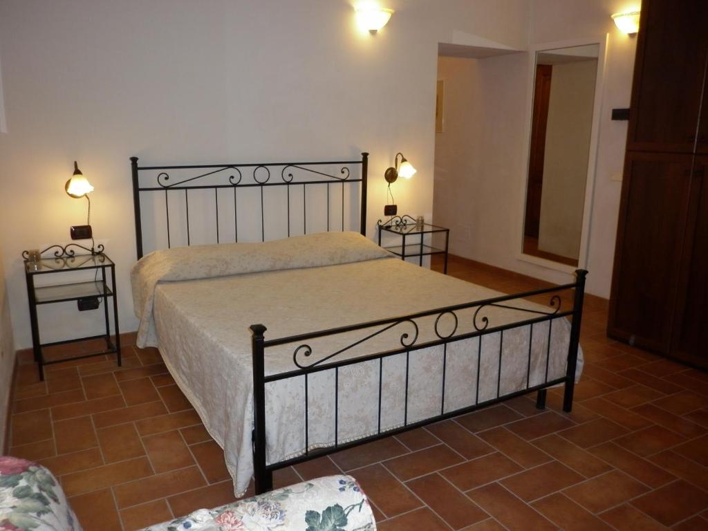 Postel nebo postele na pokoji v ubytování Podere Le Grotte