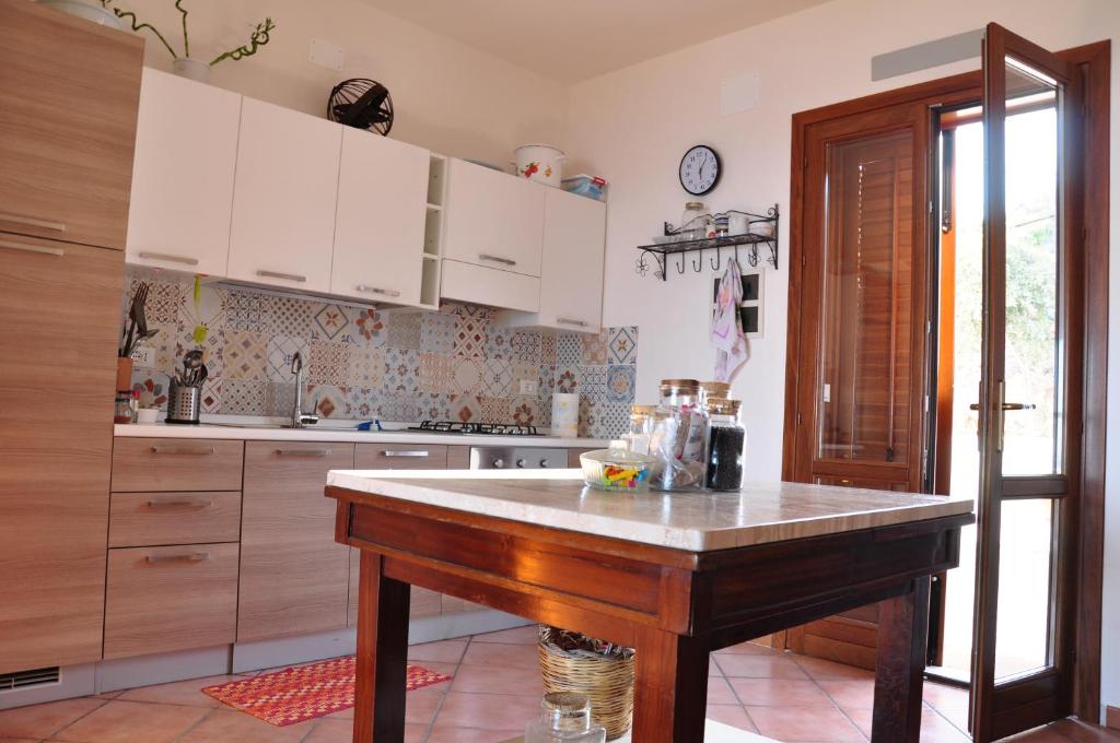 Kuchyň nebo kuchyňský kout v ubytování B&B Tre Giummare
