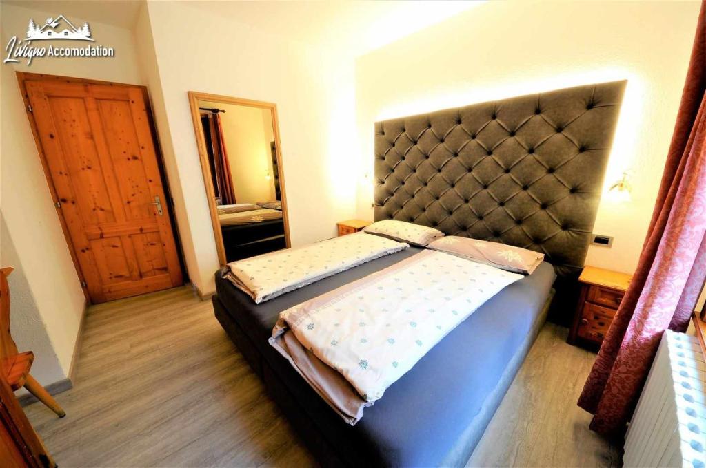 Postel nebo postele na pokoji v ubytování Residence Casa Longa by Livigno Accomodation