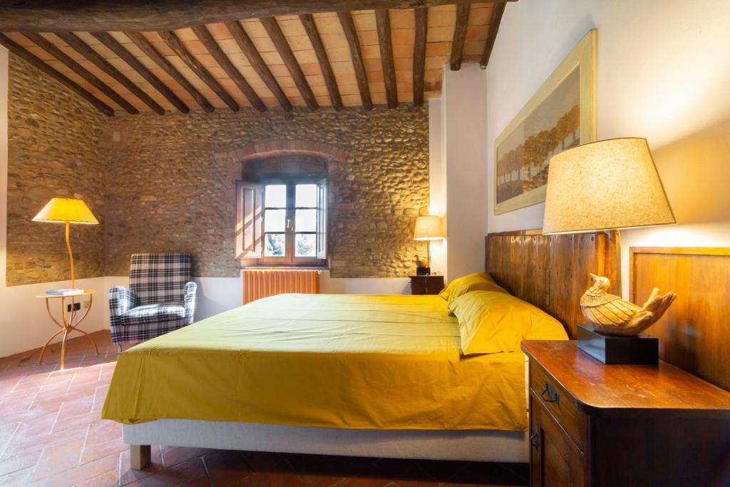 Posteľ alebo postele v izbe v ubytovaní Torre di Polvereto