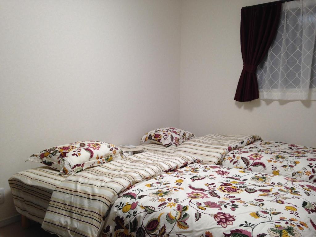 Letto o letti in una camera di Nara Guesthouse Kaede
