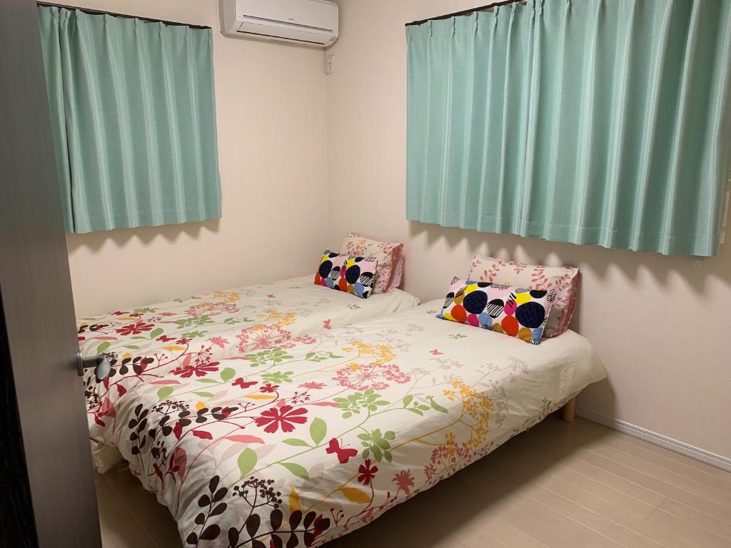 Letto o letti in una camera di Nara Guesthouse Kaede