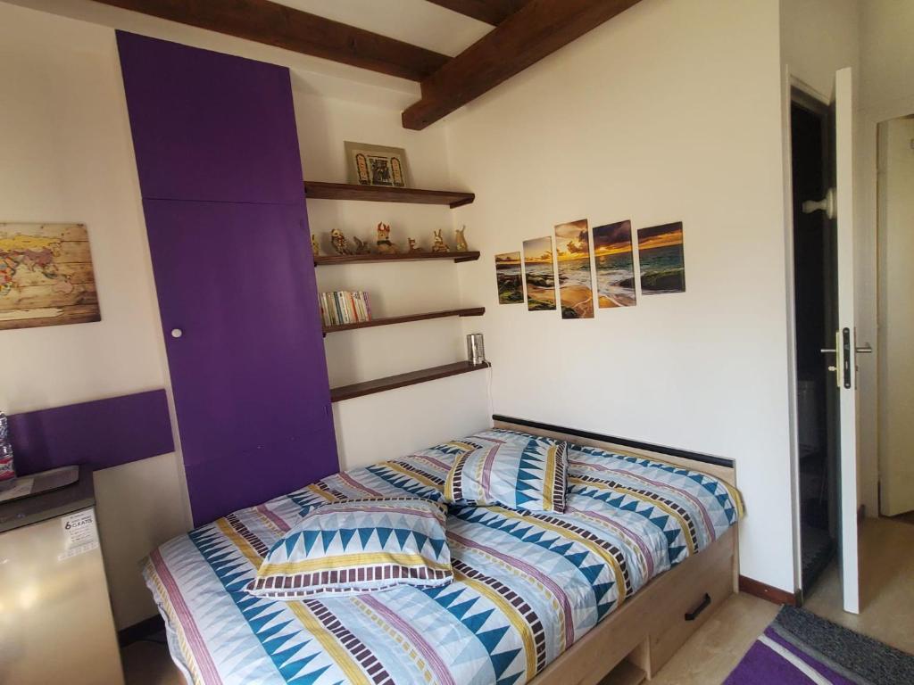 Postel nebo postele na pokoji v ubytování Maison Le Lézard chez Amalia et Fred