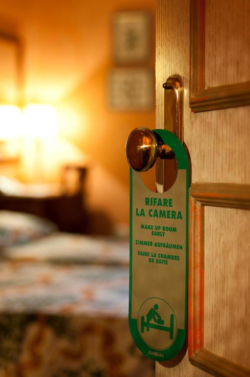 Postel nebo postele na pokoji v ubytování Hotel Vecchio Borgo