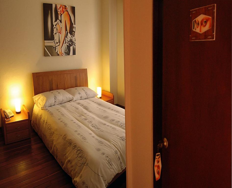 Postel nebo postele na pokoji v ubytování Hotel Casa Deco