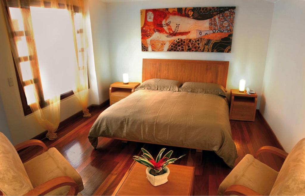 Postel nebo postele na pokoji v ubytování Hotel Casa Deco