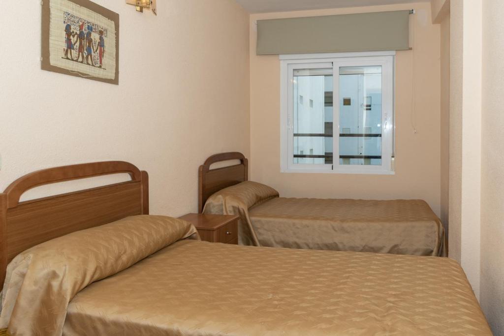 Postel nebo postele na pokoji v ubytování Mar y Montaña, 2º-18