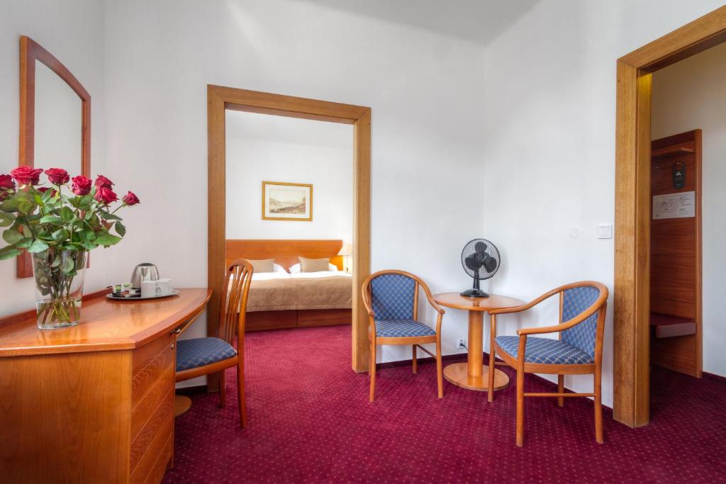 Postel nebo postele na pokoji v ubytování Hotel Harmony