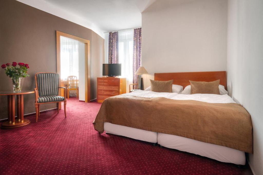 Postel nebo postele na pokoji v ubytování Hotel Harmony