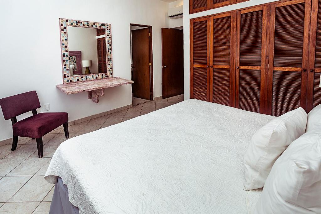 Postel nebo postele na pokoji v ubytování Fabiola Condo Hotel