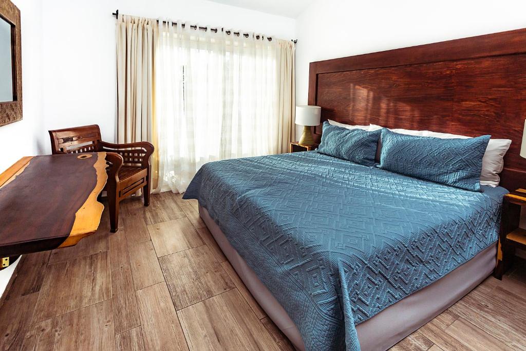 Postel nebo postele na pokoji v ubytování Fabiola Condo Hotel