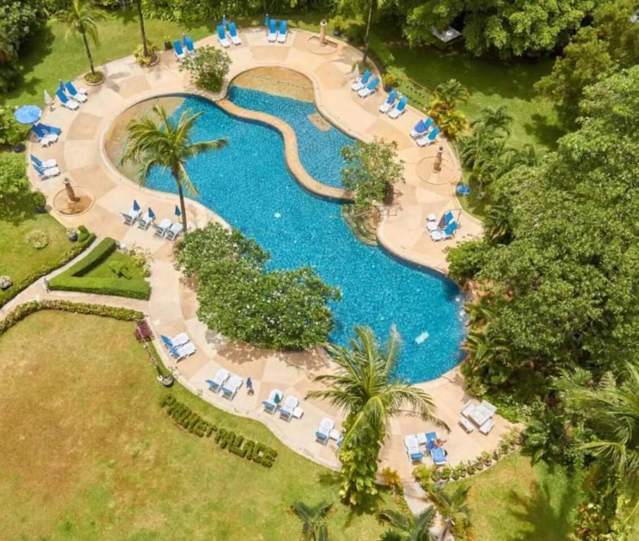 an overhead view of a swimming pool at a resort at Patong Beach Gardens - Pool Fast WiFi Smart TVs in Patong Beach