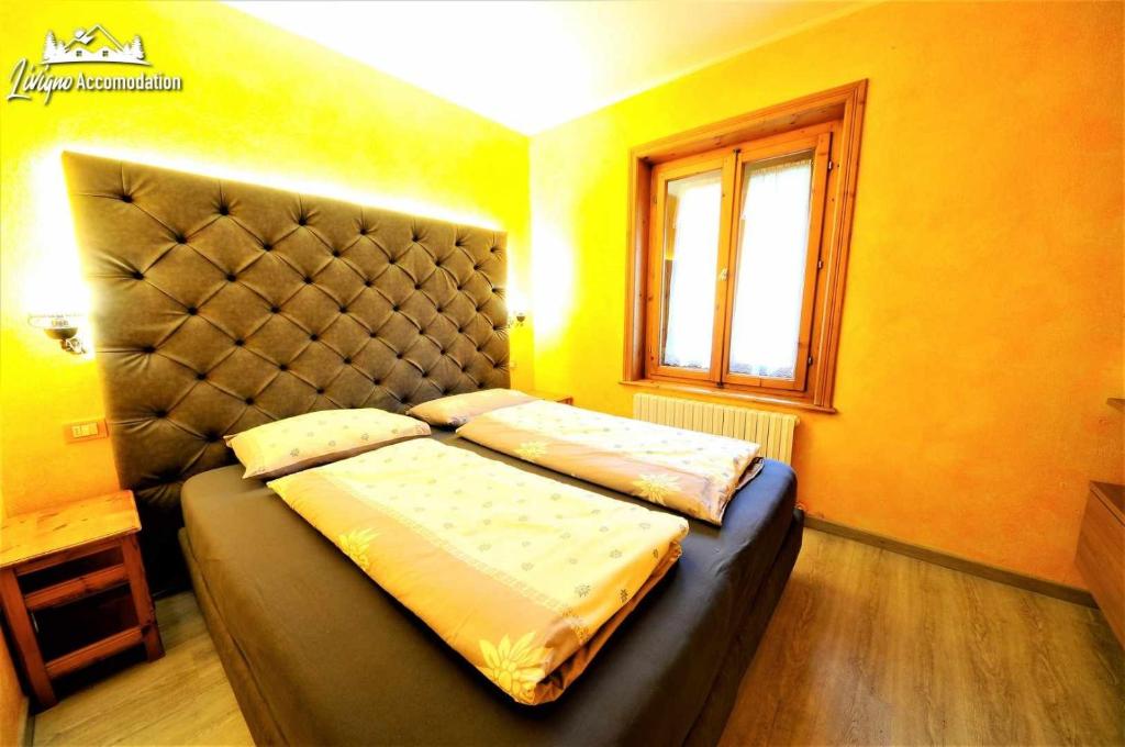 Postel nebo postele na pokoji v ubytování Residence Casa Longa by Livigno Accomodation