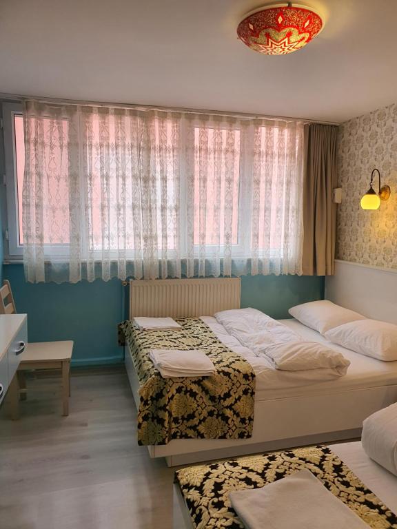 A bed or beds in a room at Tulip Guesthouse