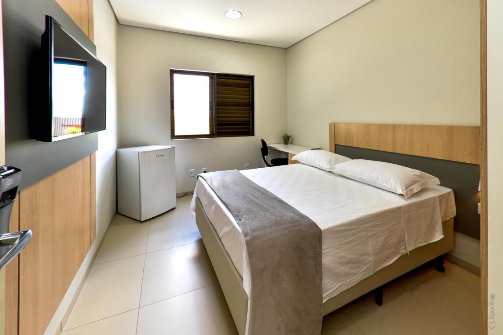 Postel nebo postele na pokoji v ubytování Hotel Plaza Garden