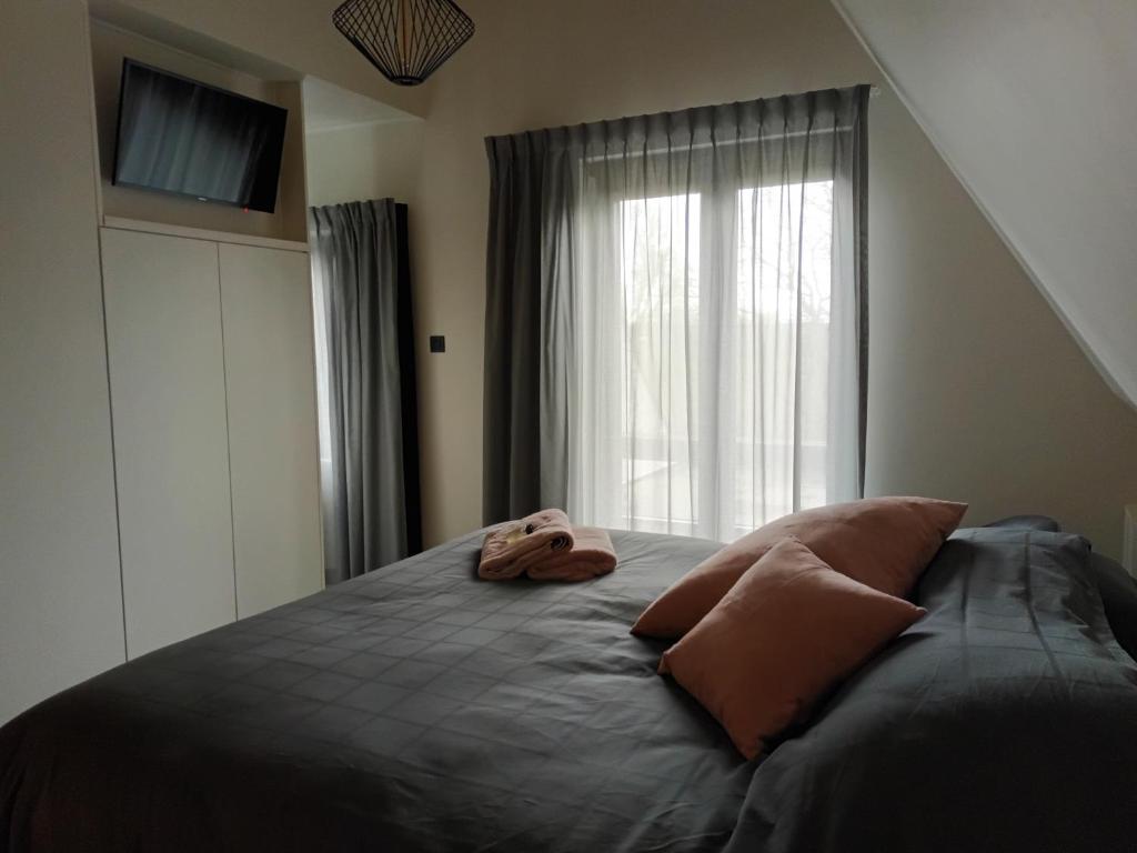 Postel nebo postele na pokoji v ubytování B&B Snelleghem