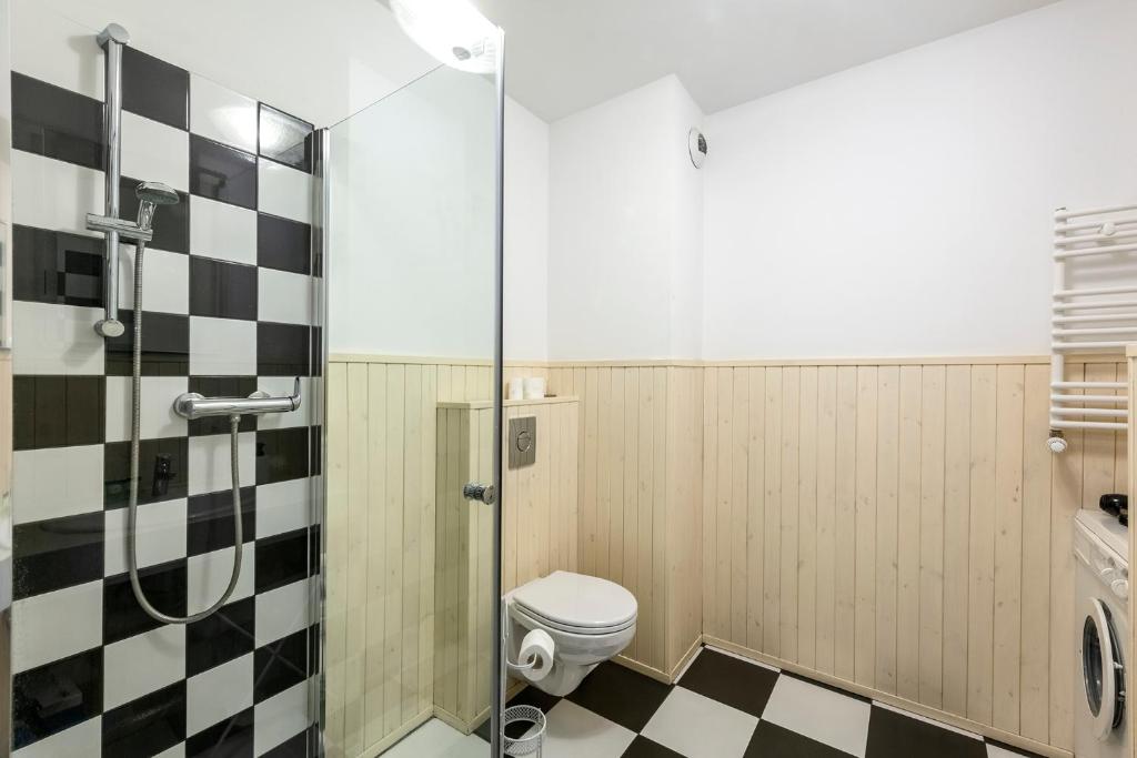 Kúpeľňa v ubytovaní Waw Apartamenty Manhattan