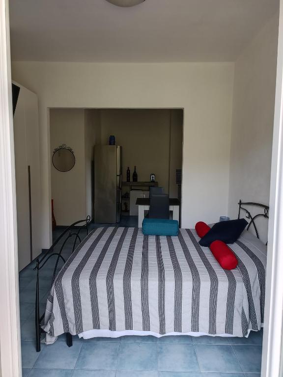 A bed or beds in a room at Villa Caribe affittacamere