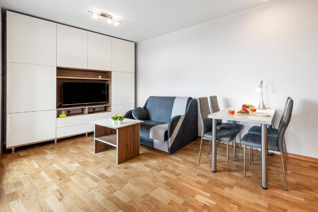 Kuchyňa alebo kuchynka v ubytovaní Waw Apartamenty Manhattan