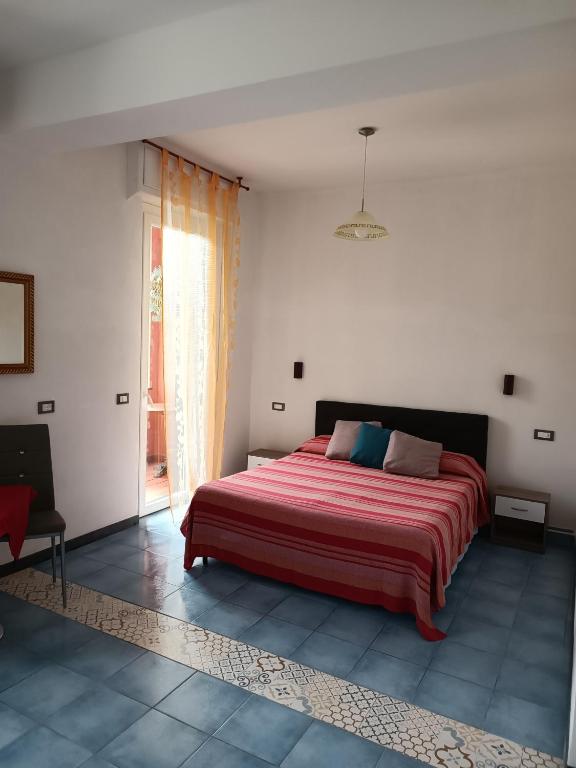 A bed or beds in a room at Villa Caribe affittacamere