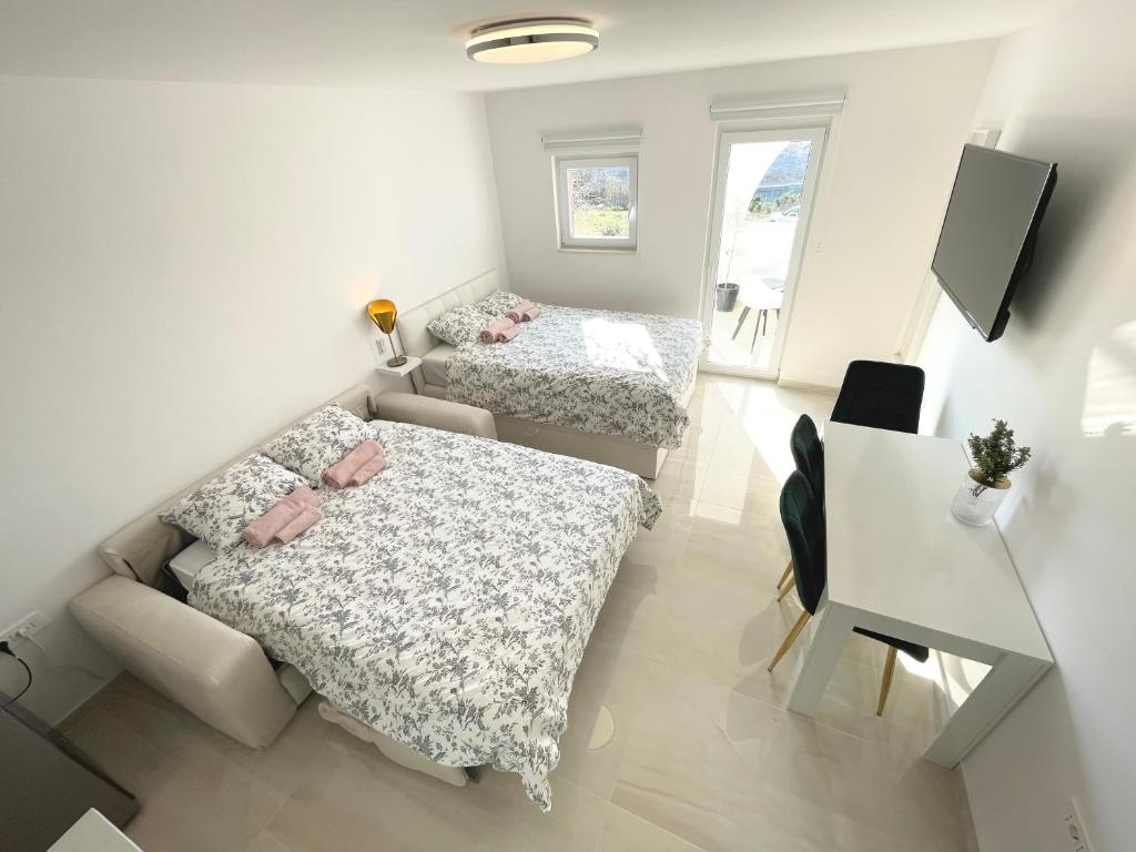 Posteľ alebo postele v izbe v ubytovaní Apartment Vila **