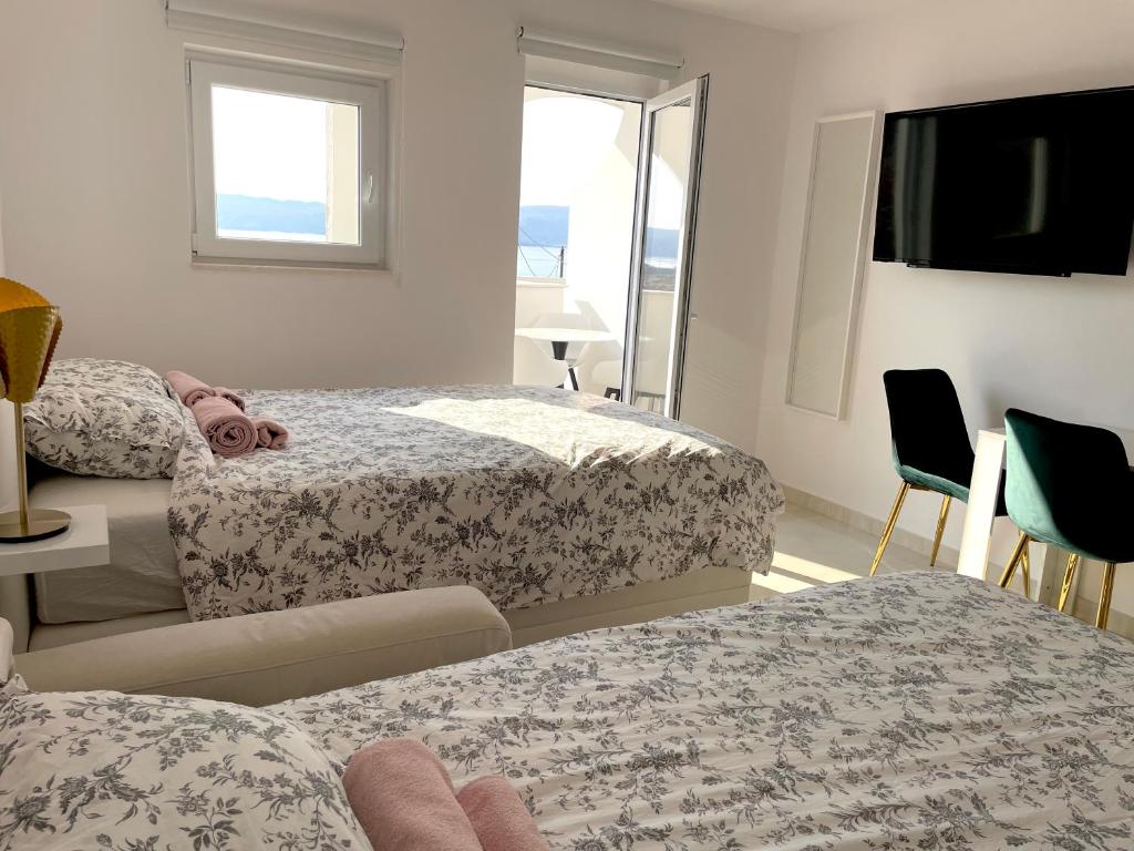 Posteľ alebo postele v izbe v ubytovaní Apartment Vila **