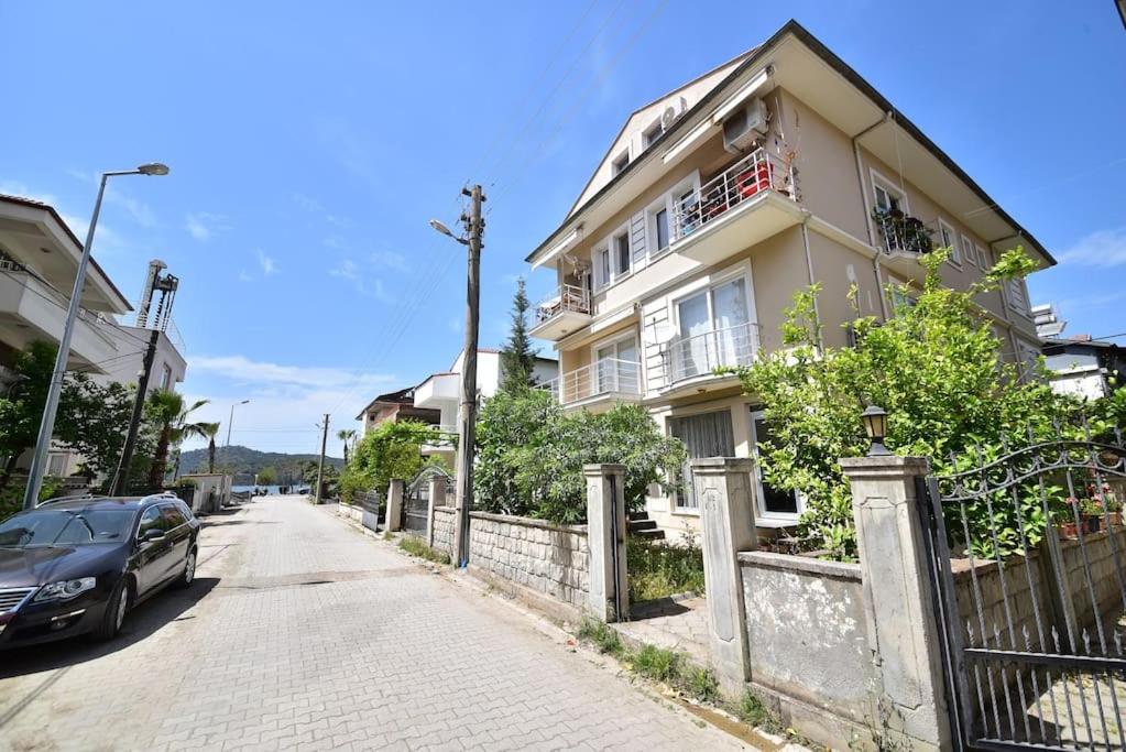 a car parked in front of a house on a street at Kaya Suite in Fethiye