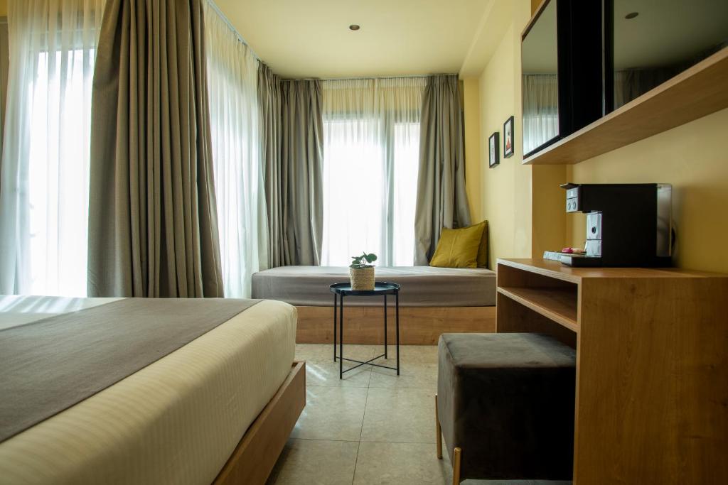 Posteľ alebo postele v izbe v ubytovaní Metis Urbane Living Spaces