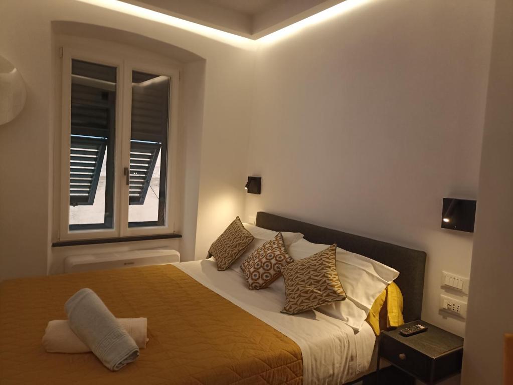 Кровать или кровати в номере Al Porto 61 - Rooms for Rent