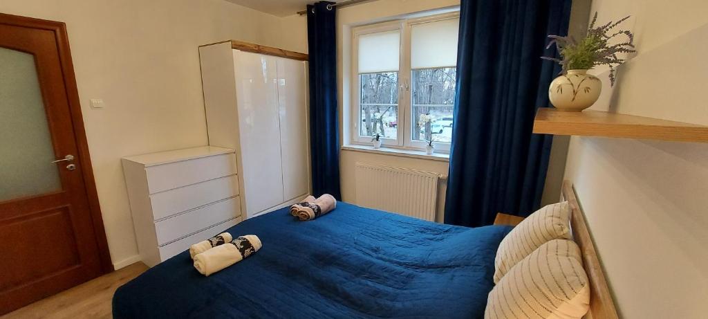 Posteľ alebo postele v izbe v ubytovaní Apartament Piastowska