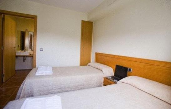 Postel nebo postele na pokoji v ubytování Amolls Restaurant i Habitacions
